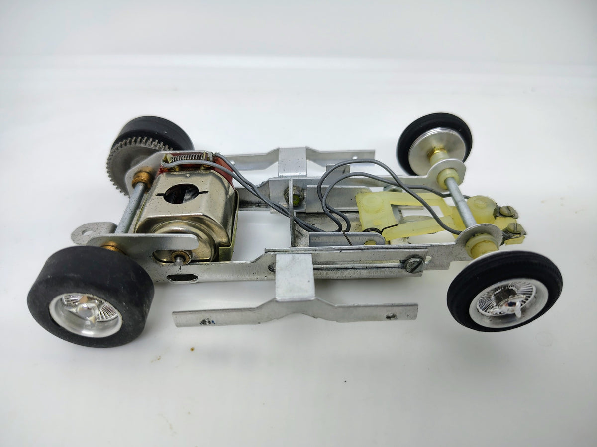 Vintage MPC Ford J Car chassis motor and rear gear detail