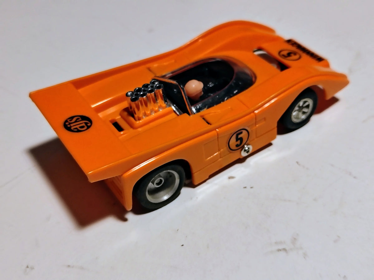 AJ's Winnwagen McLaren orange rear three-quarter view and AJ's silicone rear tires