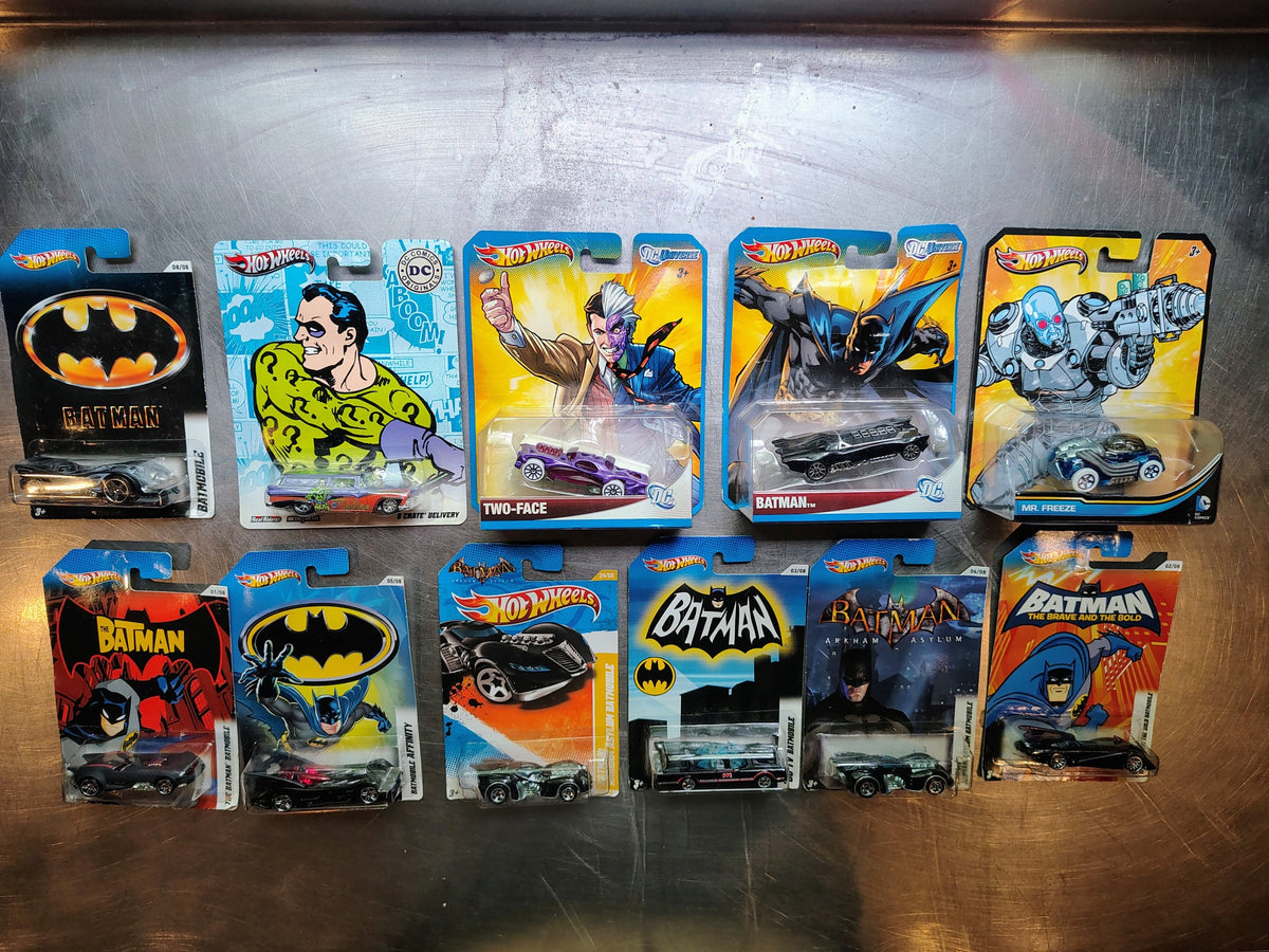 Eleven Hot Wheels Batman and DC Comics collectible diecast cars in original card packaging