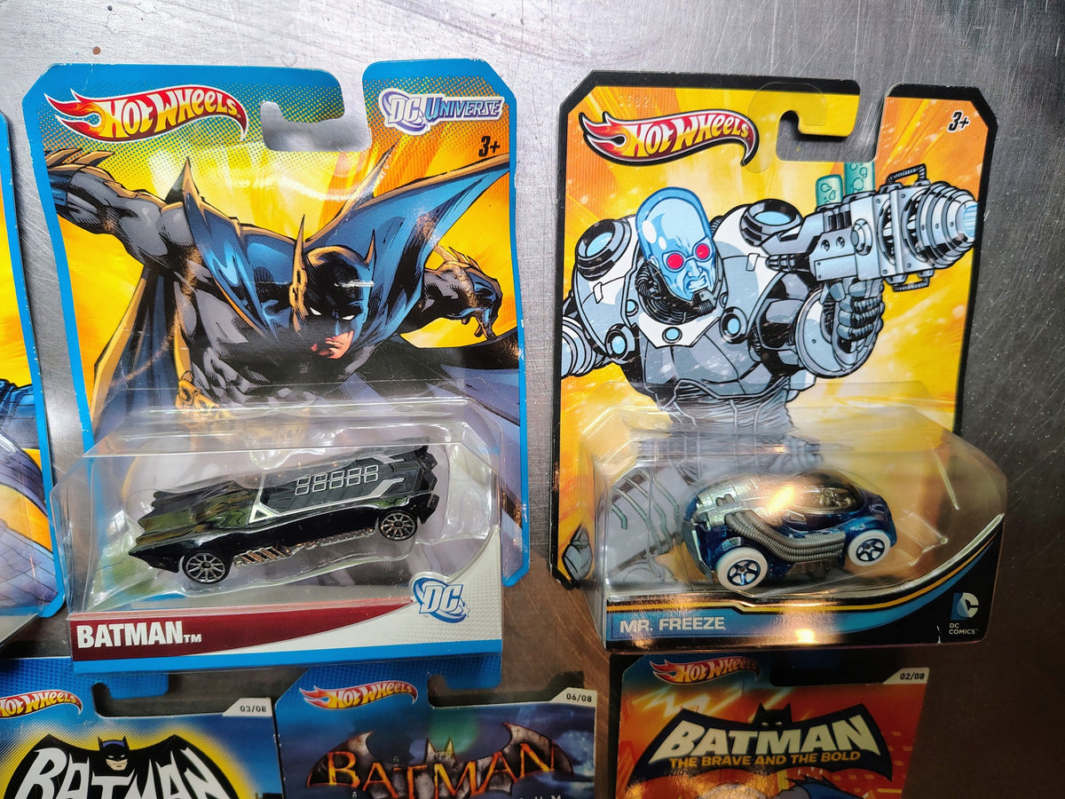 Batman Hot Wheels and Batmobile diecast models with illustrated original cards
