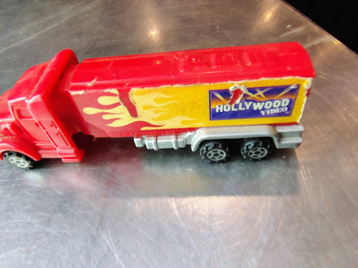 Hollywood Video red and yellow advertising truck front angle