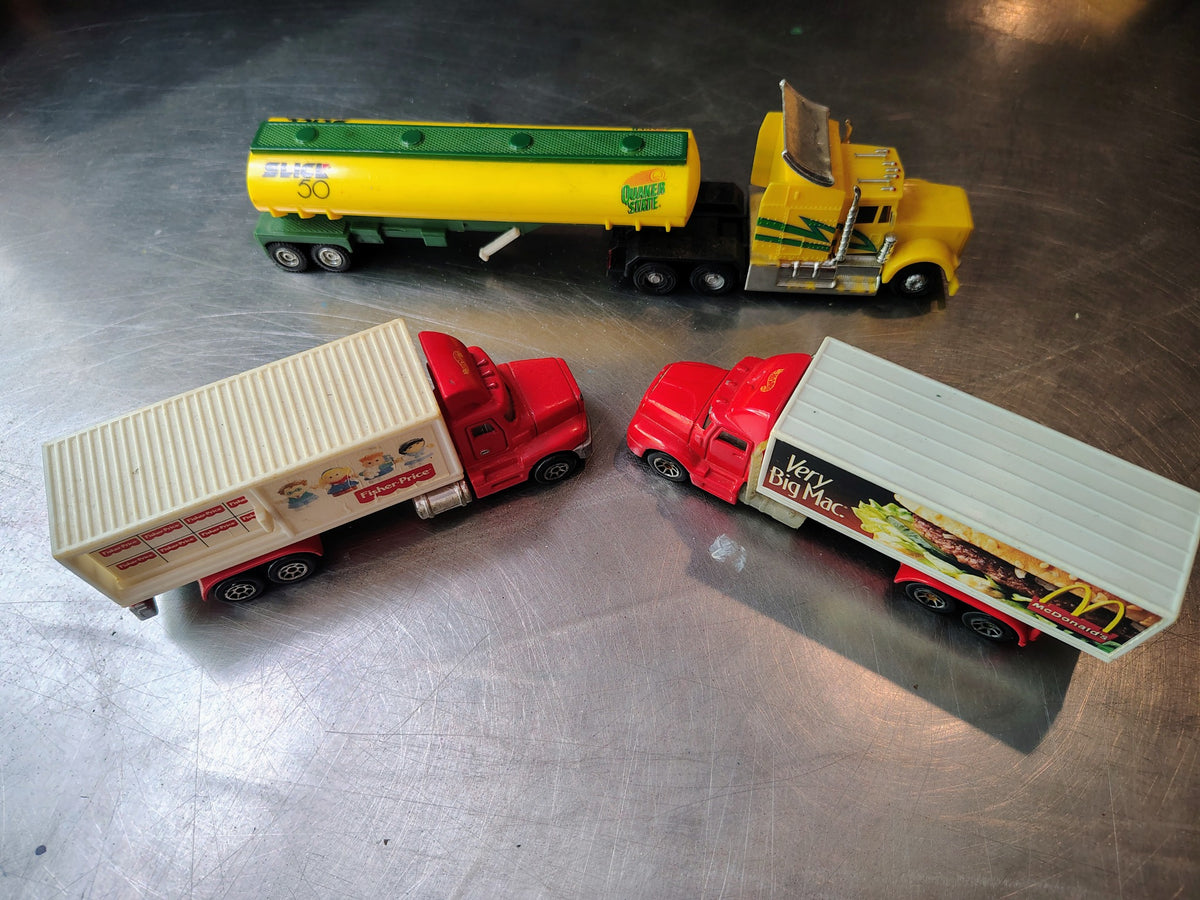 Actual lot of 4 vintage promotional diecast semi trucks Hot Wheels and Maisto