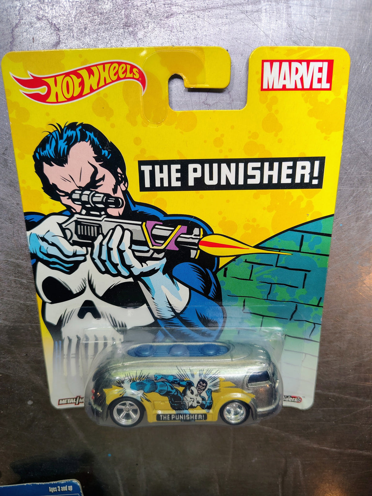 Actual included collectible 6: Hot Wheels Marvel The Punisher metal-on-metal graphic collectible van in its illustrated card.