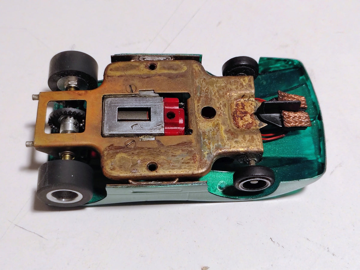 Underside detail vintage brass pan chassis and Pactra Hemi red-endbell motor