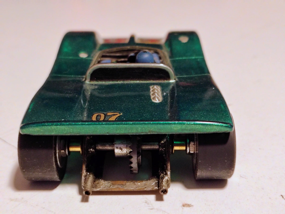 Green 1/32 vintage Can-Am #07 rear view showing gearing and silicone tires