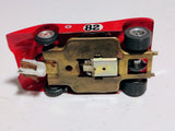 Underside of Riggen stamped brass chassis with inline Wilson motor, guide and rear tires