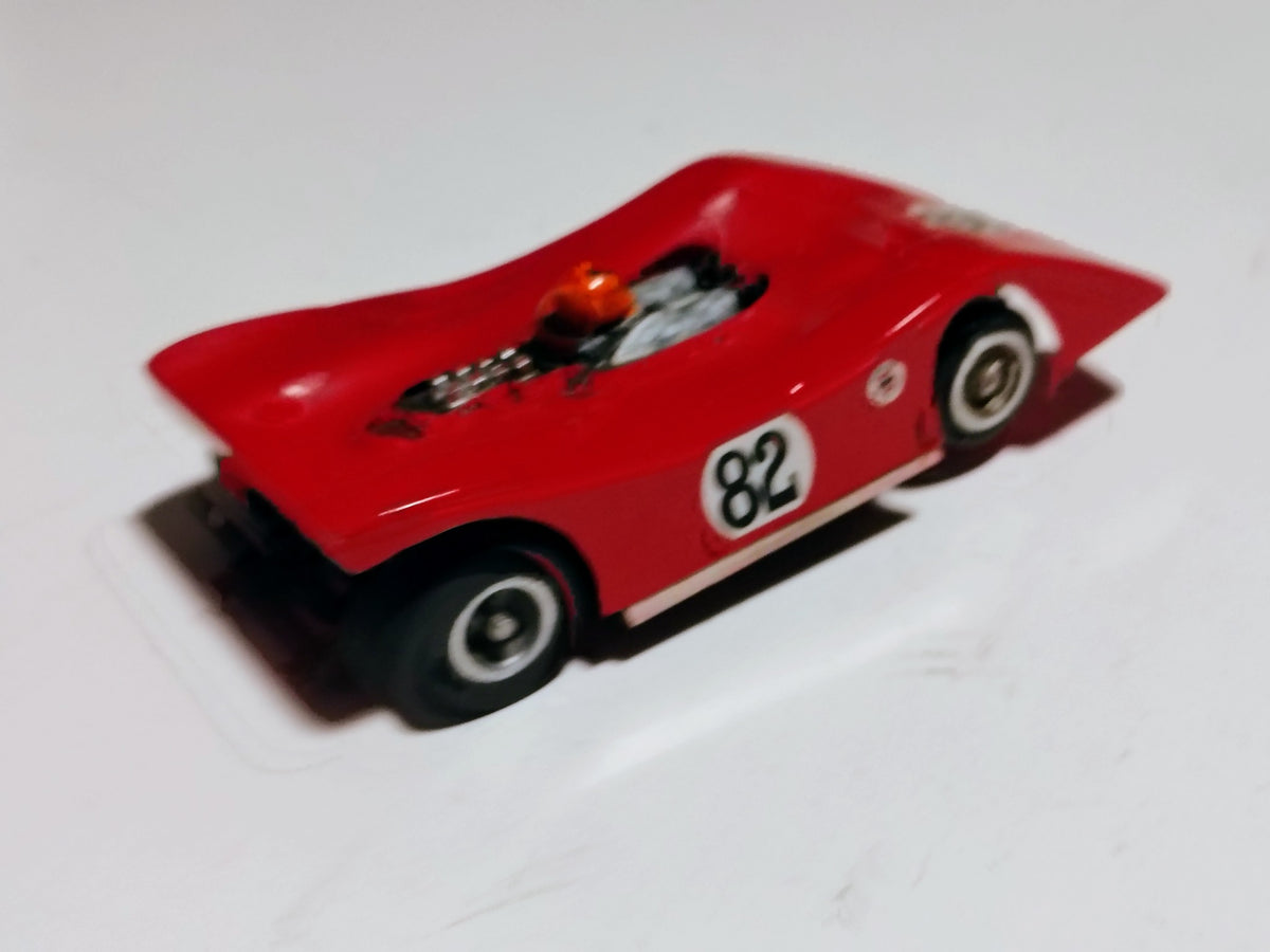 Rear three-quarter angle vintage Ti-22 #82 Can-Am red body