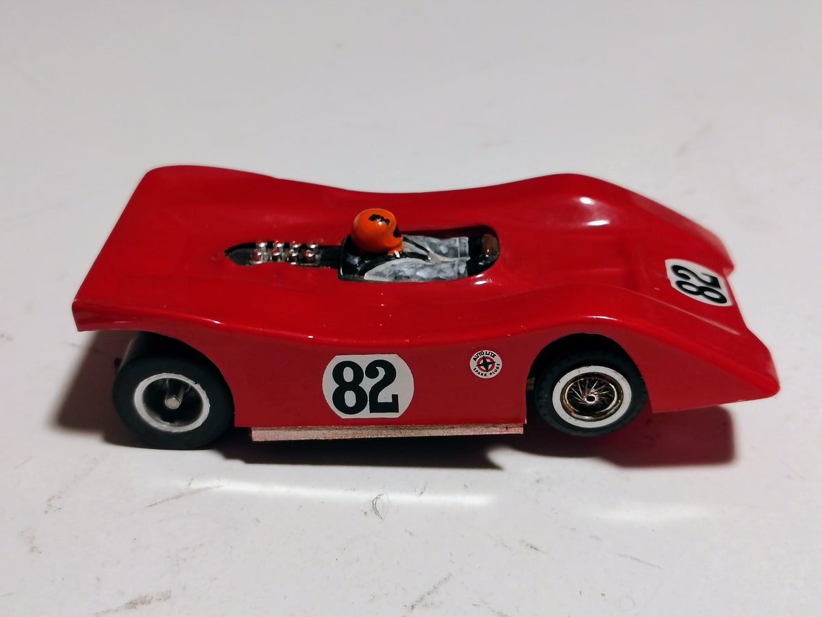 Side profile red Ti-22 #82 slot car with wheel details and driver
